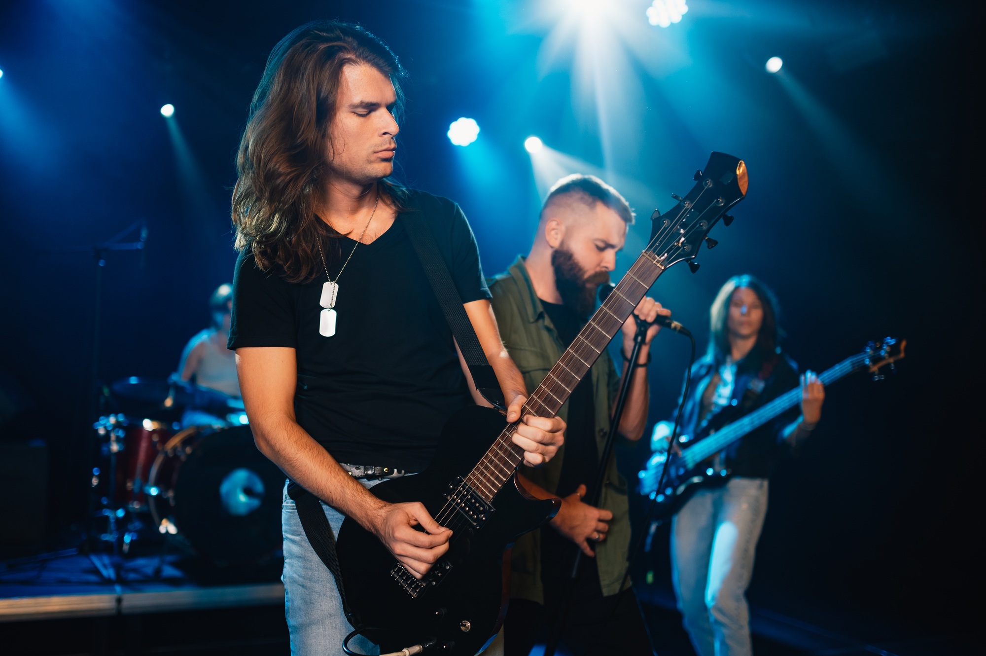 Rock band performing live on stage with passion and energy
